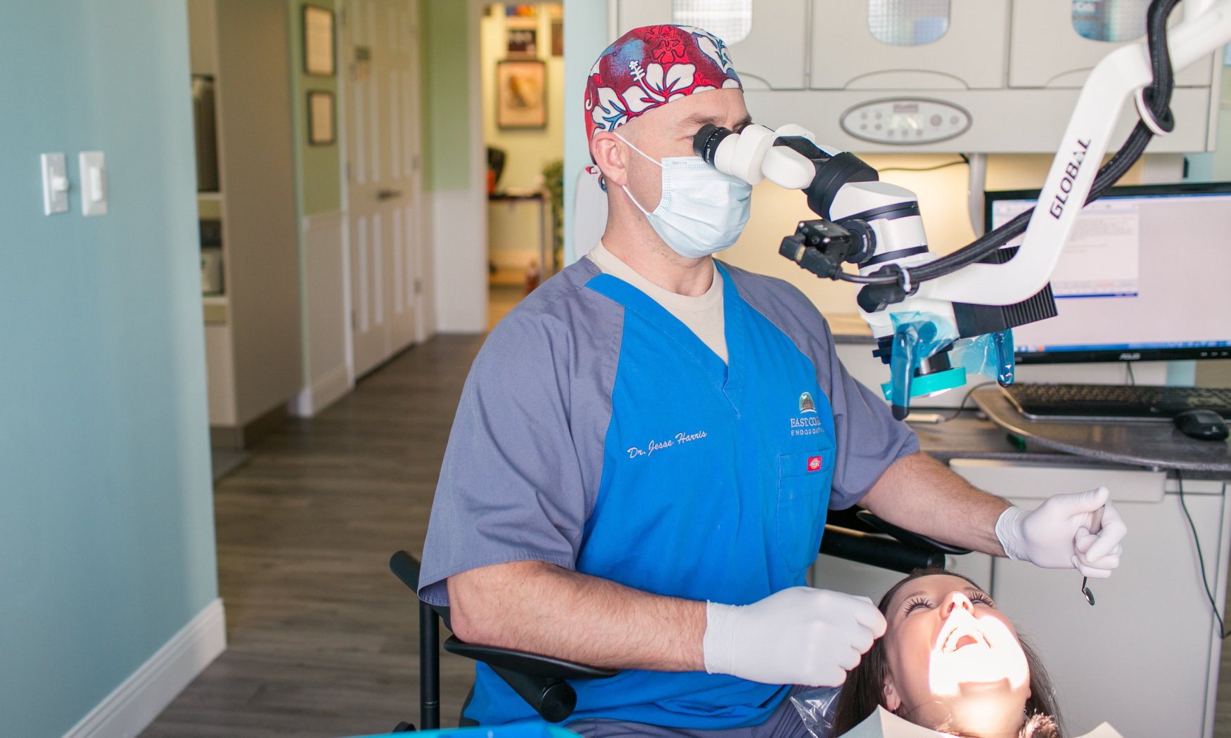 Dr. Jesse Harris performs a painless root canal on a patient.