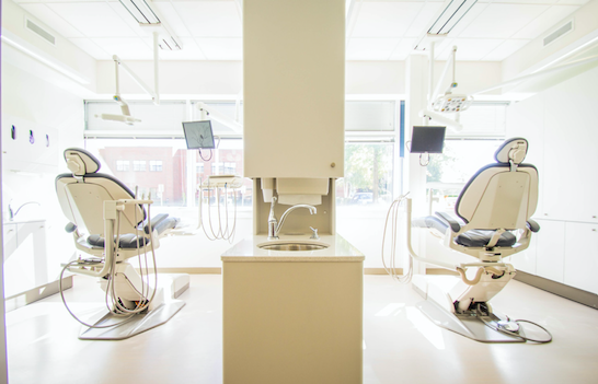 Chairs in a dental office sit ready for patients.